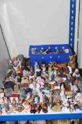 Collection of Wade Whimsies and other animal ornaments and wall mounted display case