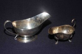 Silver sauce boat with reeded borders, Birmingham 1919, together with smaller sauce boat,