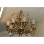Twelve branch brass chandelier with shades and collection of mainly railway related prints