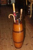 Oak coopered bulbous stick stand with brollies and sticks