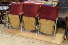 Bank of three vintage cinema seats on later wooden plinth