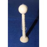 Carved ivory ball and cup game,