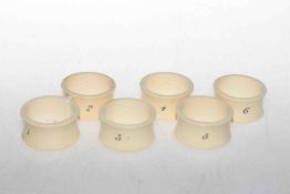 Set of six numbered ivory napkin rings,