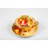 Royal Worcester tea cup and saucer, decorated with hand painted fallen fruit in a naturalistic