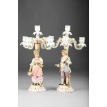 Pair of continental porcelain figure candelabra four light, courting couple raised on Rococo style