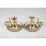 Pair William IV silver chamber candlesticks, circular bases gadrooned edge, with conical snuffers,