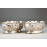 Pair Victorian silver bread baskets, oval form, embossed decoration with swags and tails and