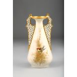 Worcester Royal China works vase with reticulated handles and decorated with a small bird, 20cm