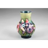 Moorcroft pottery vase, orchid pattern, 18cm high