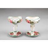 Pair Wemyss Ware candlesticks, hand painted with cabbage roses, signed and incised Wemyss to base,