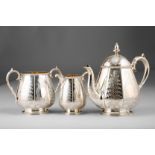 Victorian three piece silver tea service, chased floral decoration, Assay marked London 1875 by