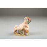 Royal Worcester Figure ornament, a putti figure with vines and grapes, 8cm high