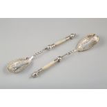 Pair of mother of pearl handled electro plated silver berry spoons, chased scroll work decorated