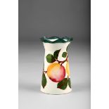 Wemyss Ware vase, fluted form with scallop rim, hand painted with peaches, incised Wemyss, retailers