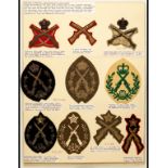 Marksmanship Prize Badges Ten Crossed Muskets arm-badges, six of these in gold embroidery on blue or