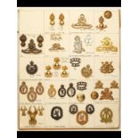 South African Military Insignia. A card mounted with metal KC period cap and collar badges and