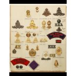 A Collection of Australian Insignia A card of KC and QEC cap and/or collar-badges, buttons and STs