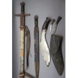 A SUDANESE SWORD (KASKARA); A NEPALESE GHURKA KNIFE (KUKRI) AND AN AFRICAN SHORTSWORD, LATE 19TH/