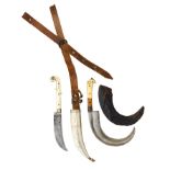 ˜TWO SMALL INDIAN DAGGERS, 19TH CENTURY the first with curved single-edged blade struck with a