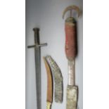 TWO SUDANESE SWORDS AND A DAGGER, 19TH CENTURY the first a kaskara, with broad fullered double-edged