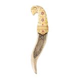 ‡ ˜AN INDIAN CARVED IVORY AND GEM-SET DAGGER, 19TH/EARLY 20TH CENTURY with recurved heavy silver