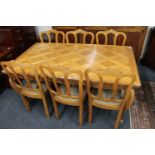 A French oak pull-out dining table on cabriole legs and six chairs