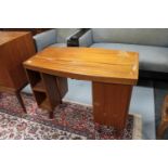 A mid 20th century teak knee hole desk