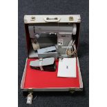 A cased Pfaff 95 electric sewing machine