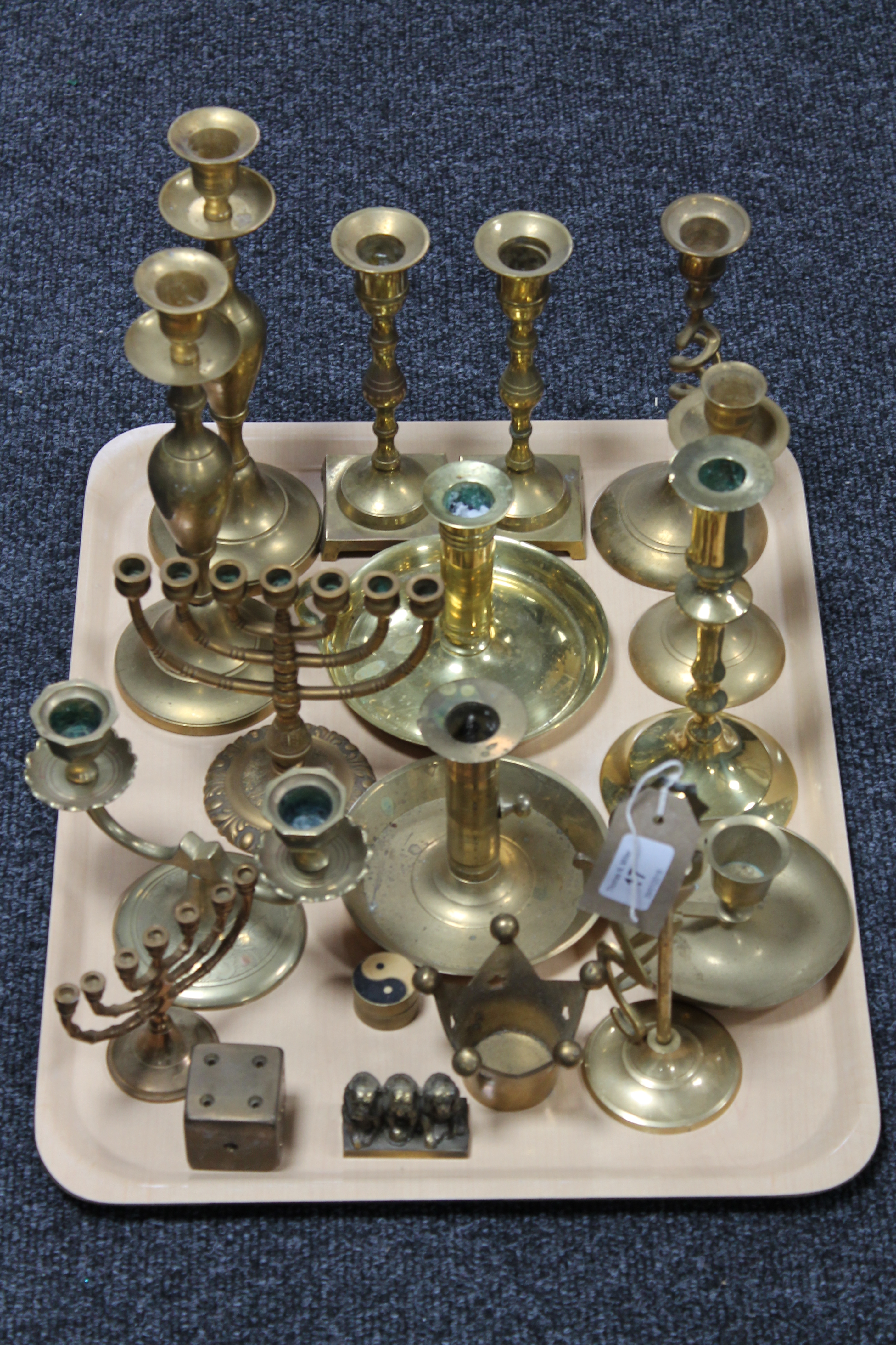 A quantity of assorted brass candlesticks,