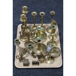 A quantity of assorted brass candlesticks,