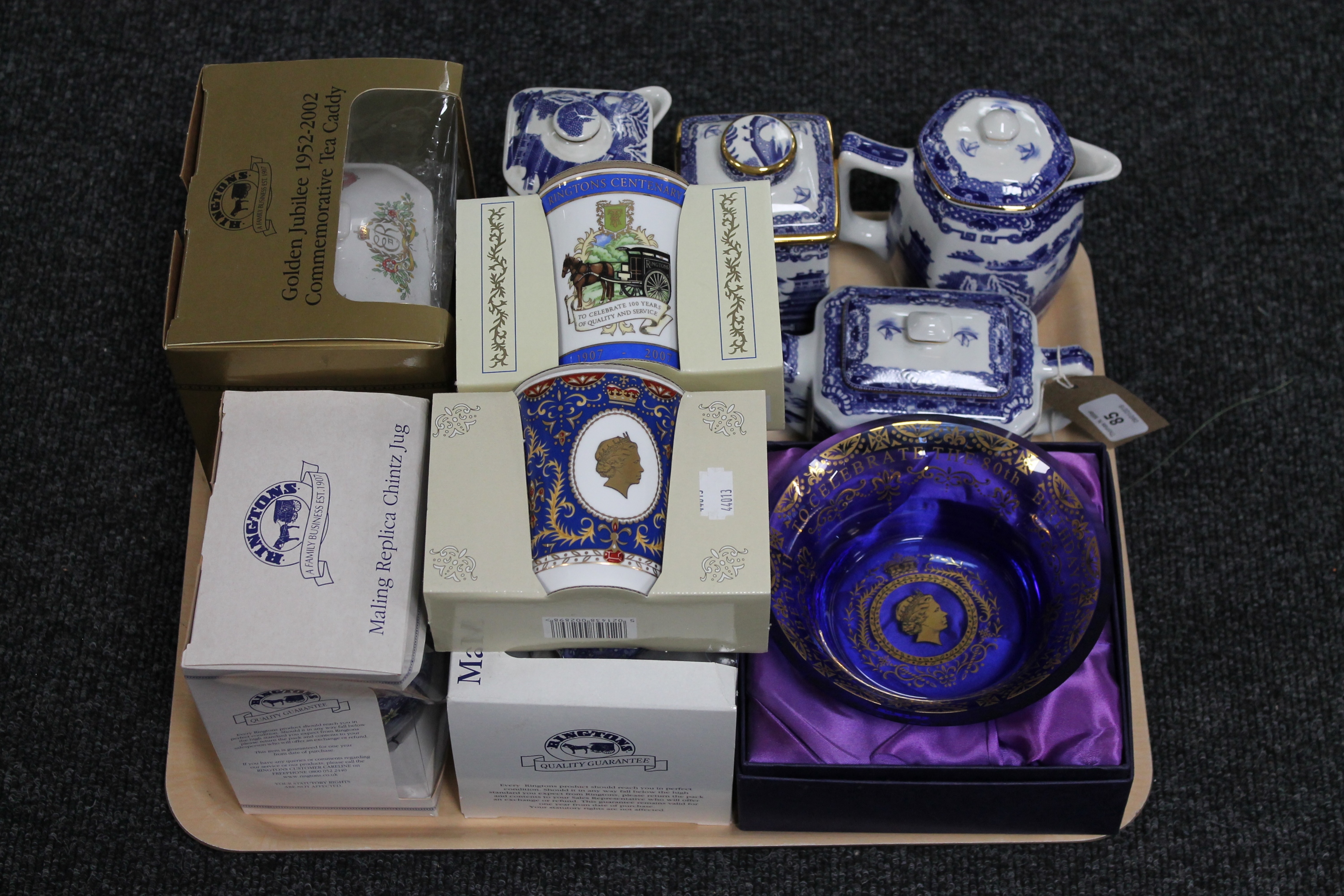 A tray of Ringtons china, Willow pattern teapot, water jugs, boxed Caddies,