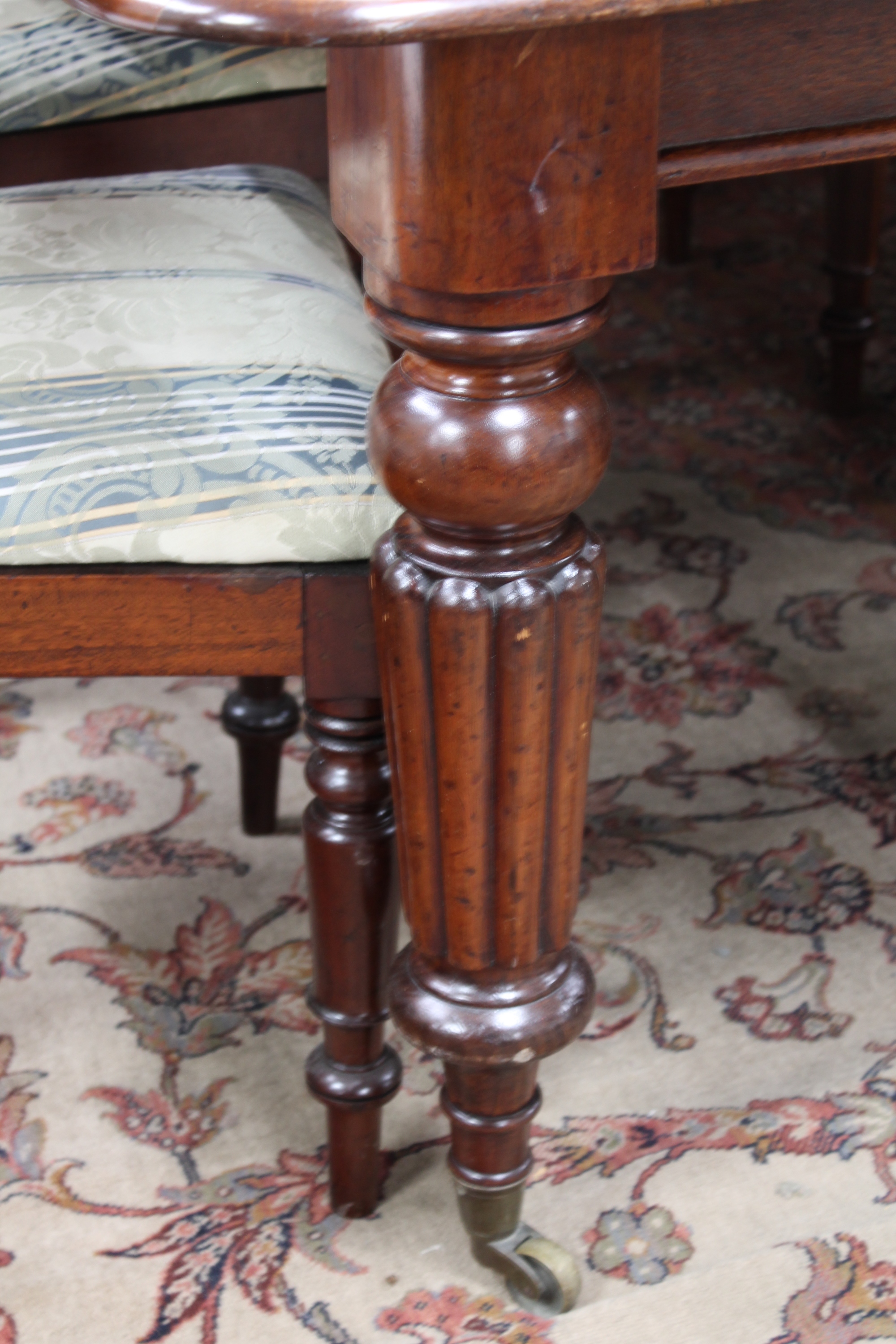 A Victorian mahogany wind-out dining table with three leaves and eight chairs CONDITION - Image 3 of 9