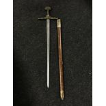 A longsword in scabbard with brass handle and pommel