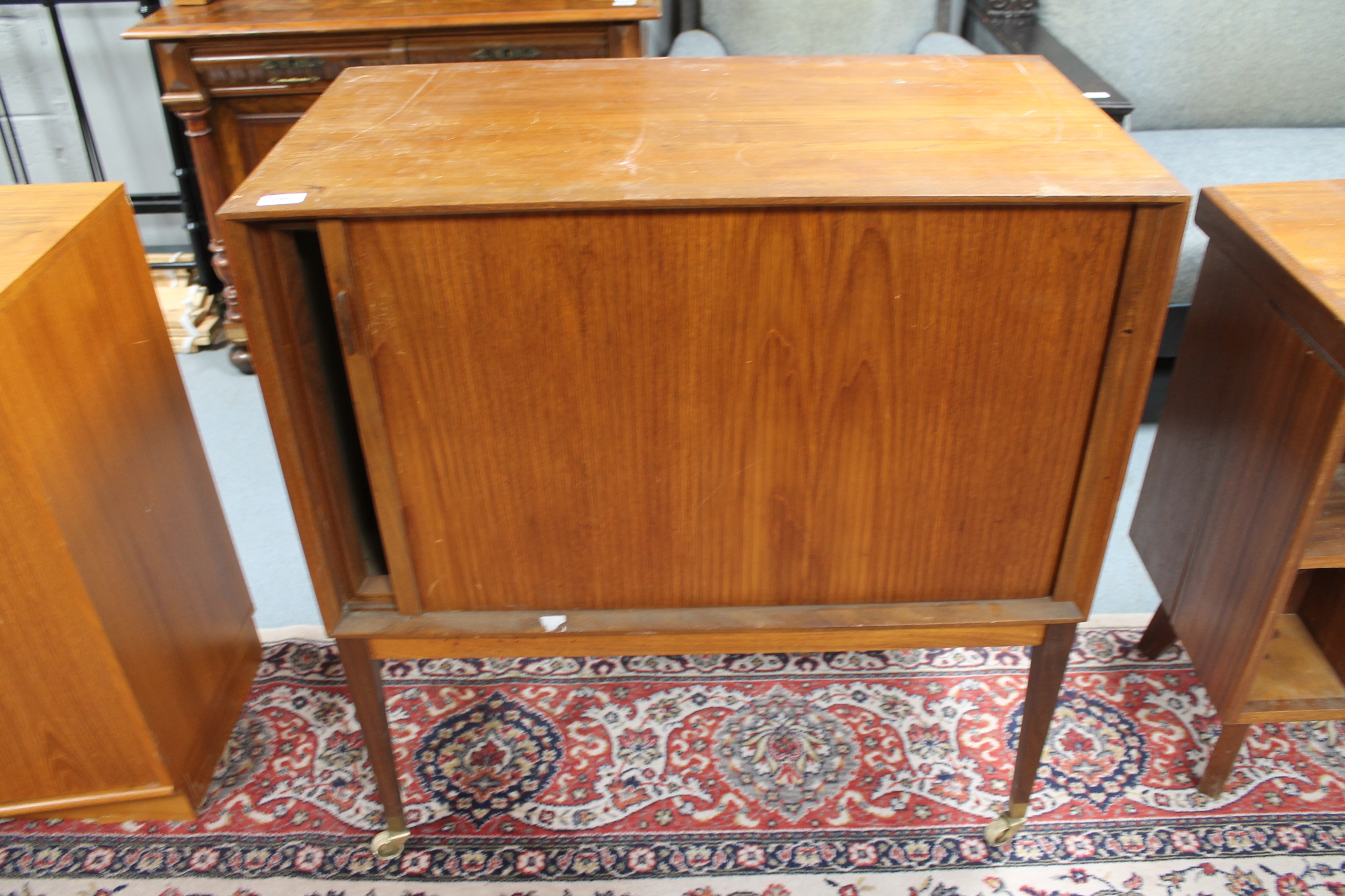 A mid 20th century Philips teak TV cabinet