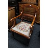 A late nineteenth century tapestry seated armchair