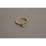 An 18ct gold solitaire diamond ring, estimated diamond weight 0.