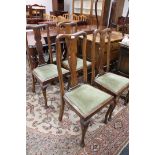 A set of four Queen Anne style dining chairs