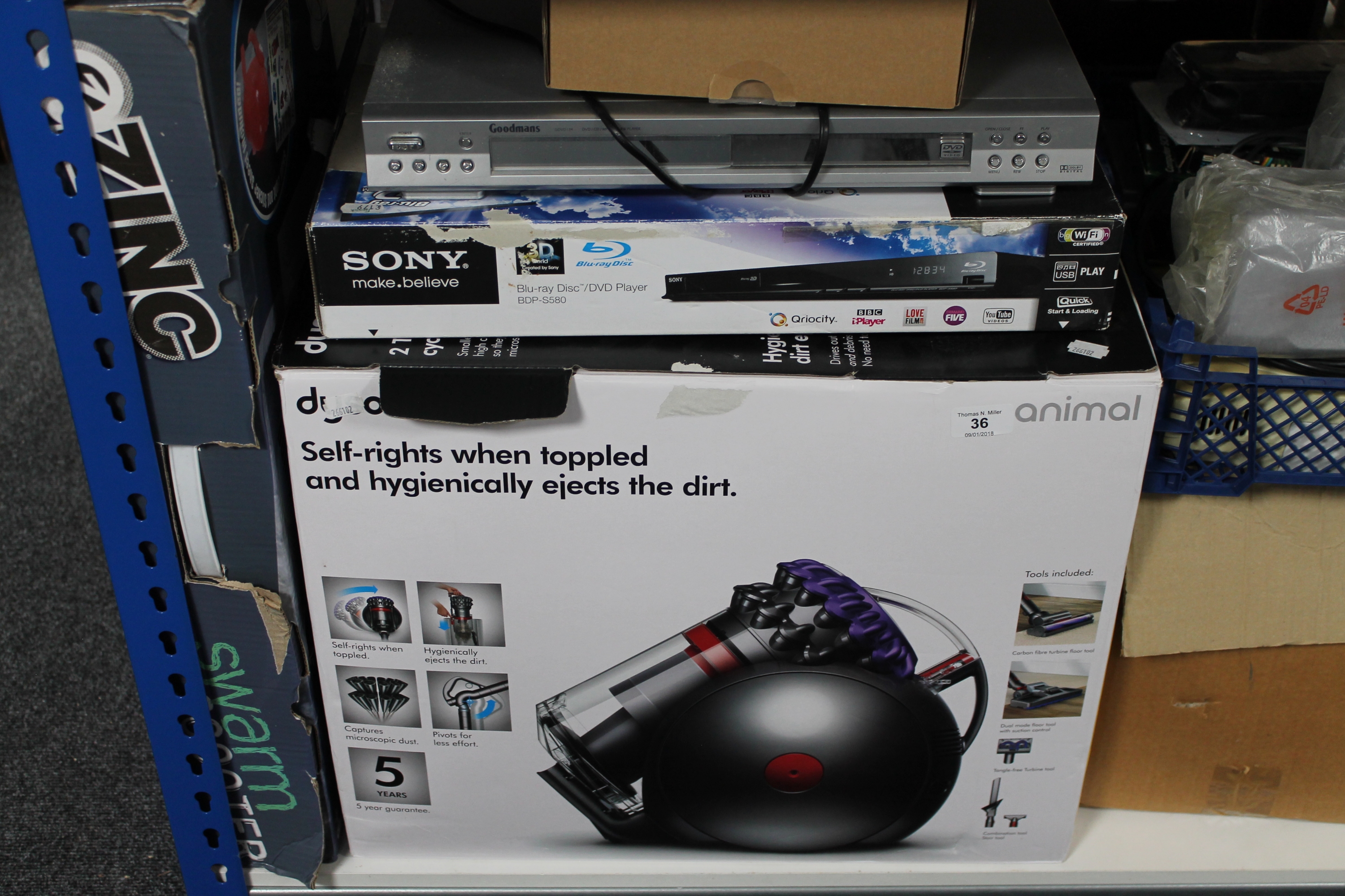 A Dyson Vac together with a Goodmans dvd player,