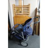 A pine child's cot and an Urban Detour push chair