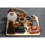 A tray of cameras, metronome, copper and brass planters.
