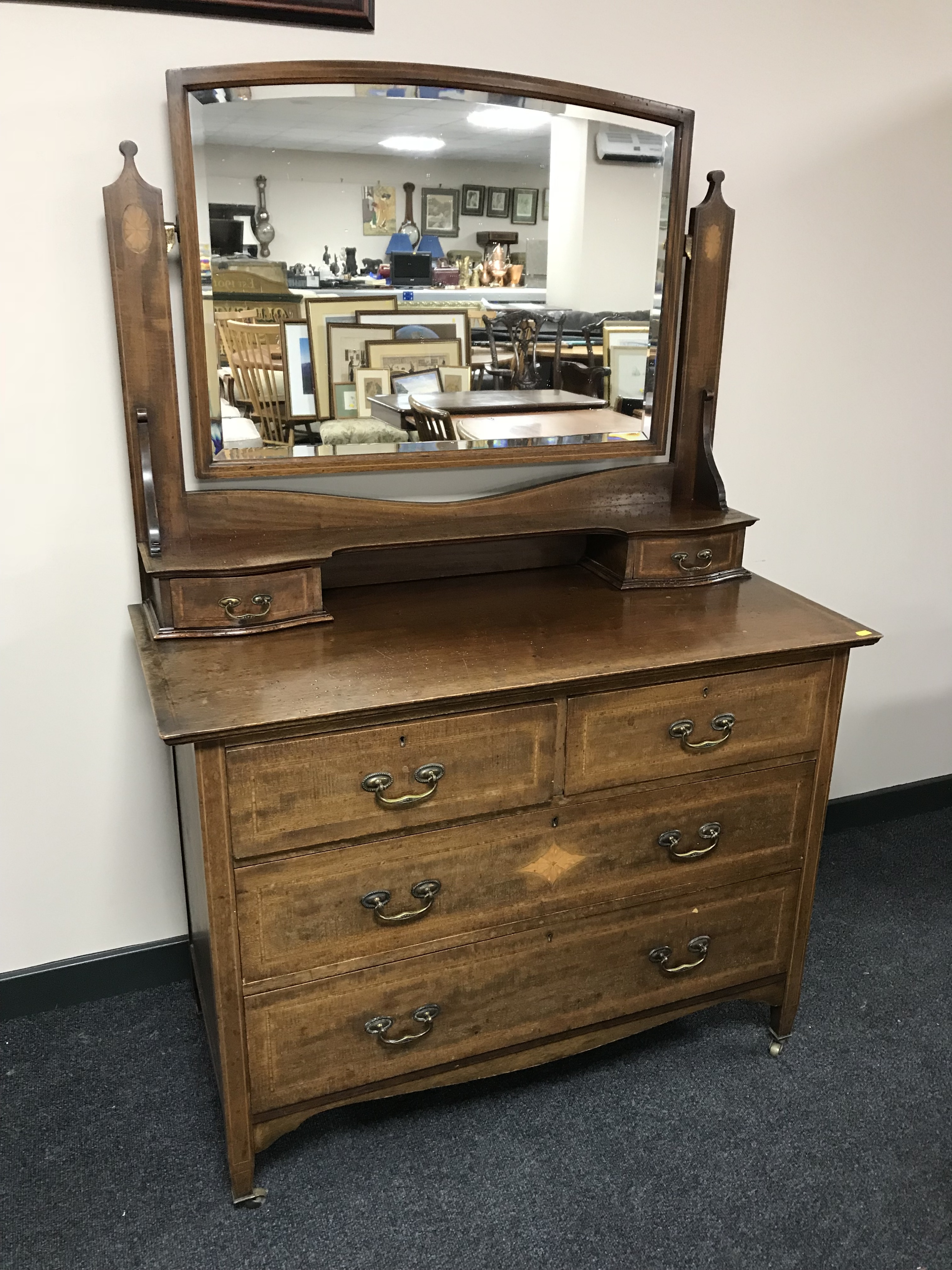 A late Victorian inlaid mahogany dressing chest