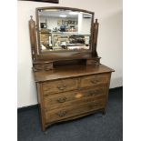 A late Victorian inlaid mahogany dressing chest