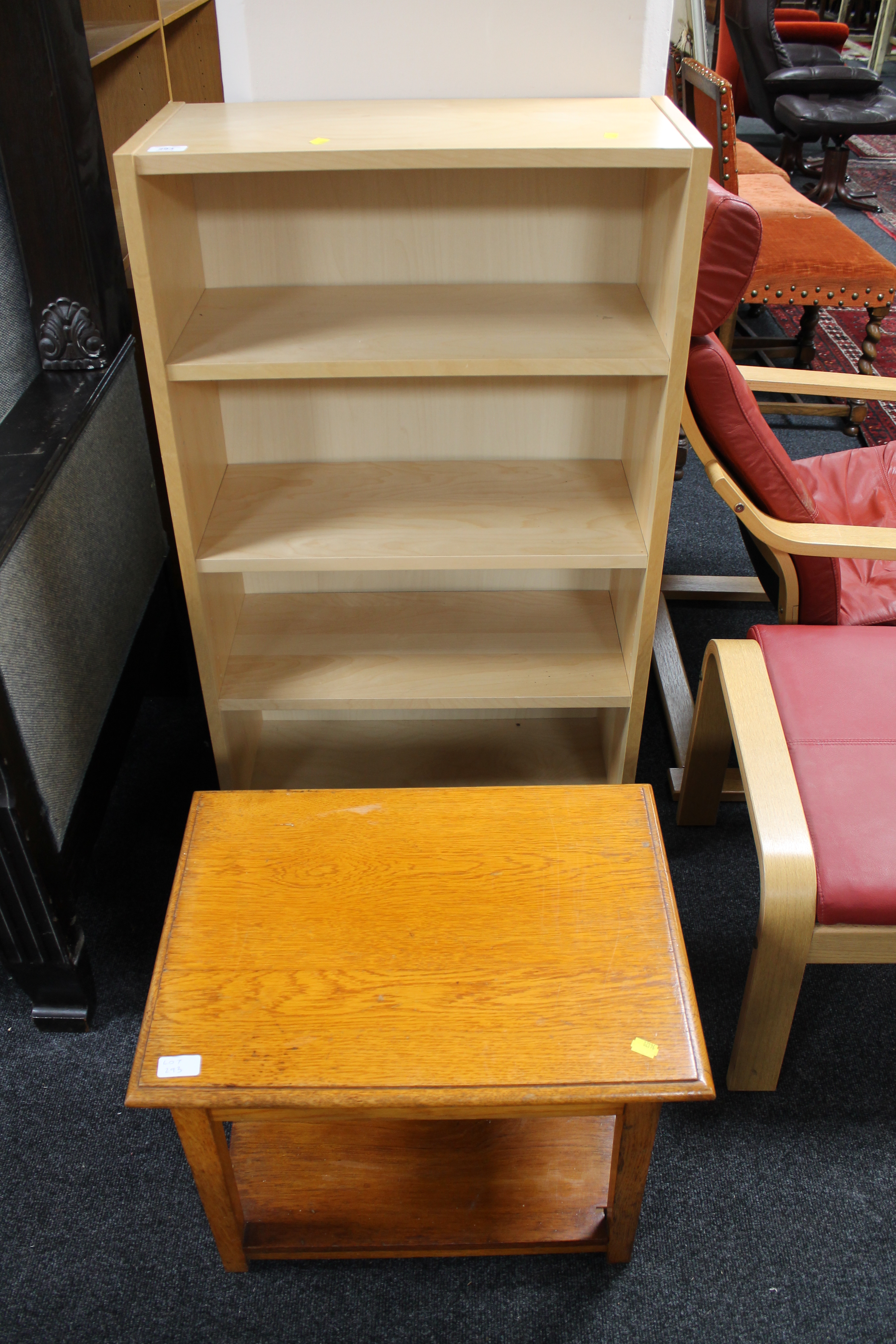 A set of contemporary open shelves and an oak coffee table