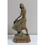 An adzed oak Art Deco figure depicting a lady in flowing dress holding a fan CONDITION