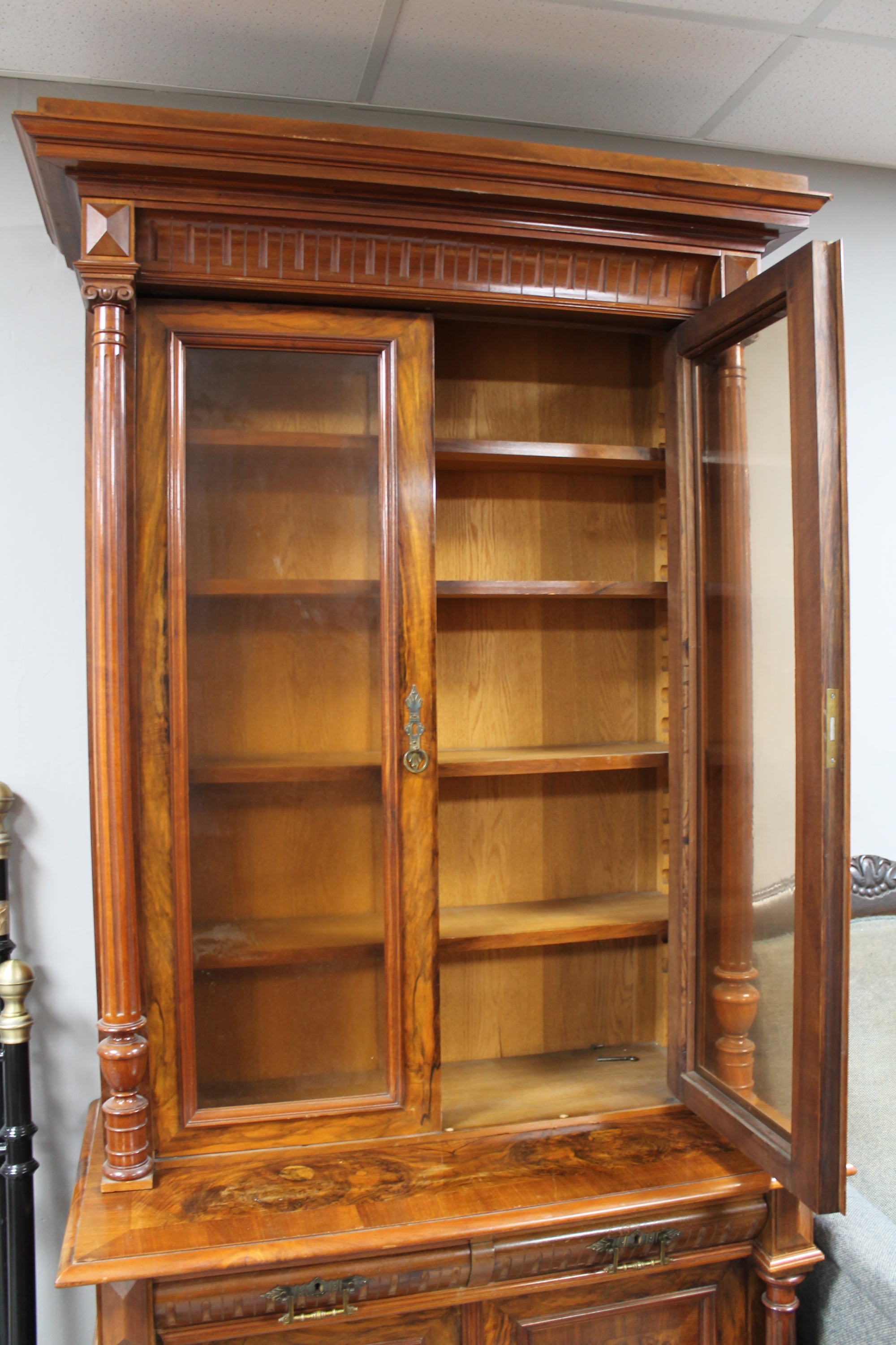 A continental walnut and mahogany bookcase with pillar supports CONDITION REPORT: - Image 7 of 9