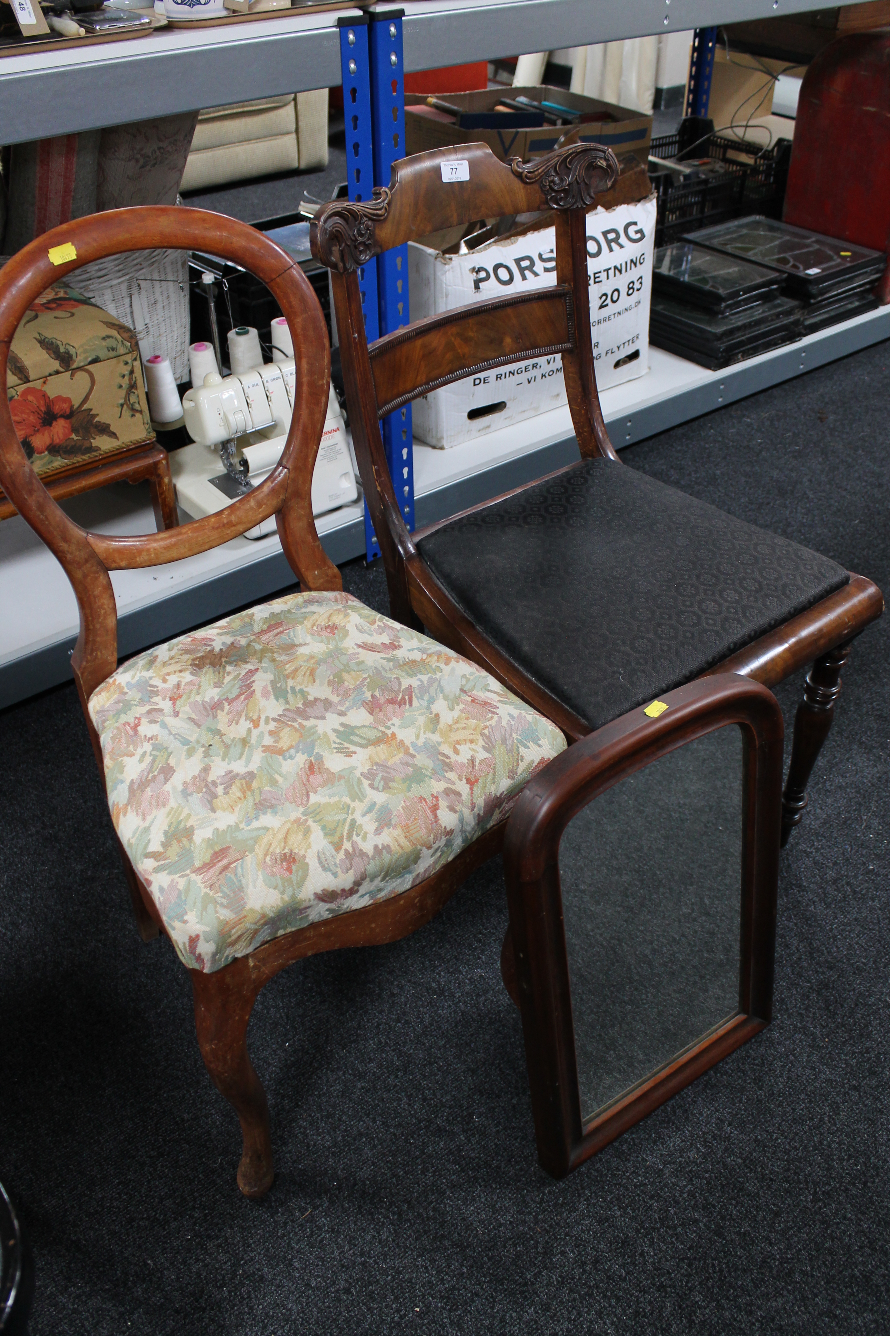 A pair of antique mahogany dining chairs together with a mahogany framed mirror