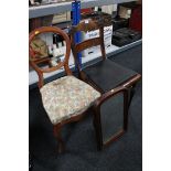 A pair of antique mahogany dining chairs together with a mahogany framed mirror