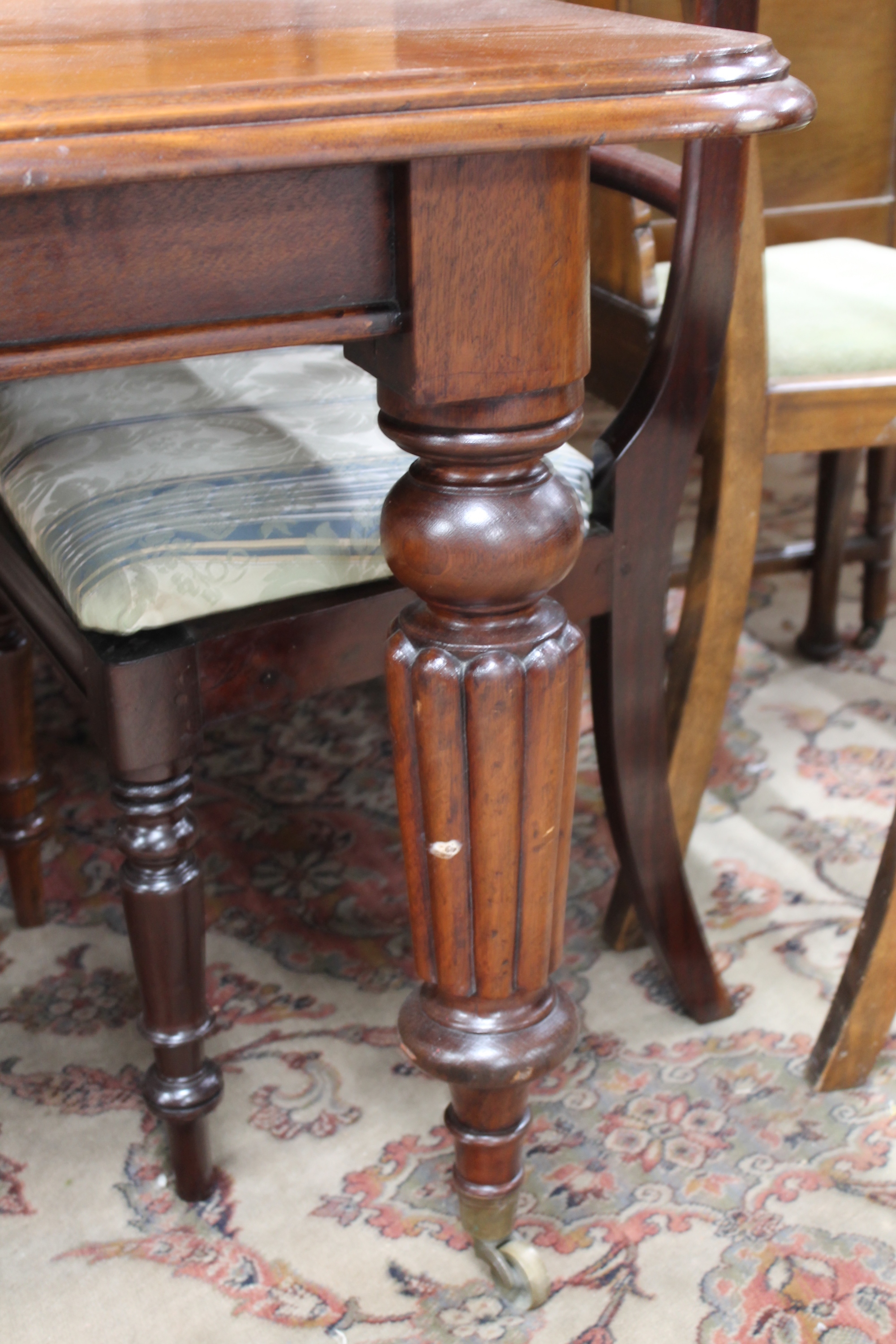 A Victorian mahogany wind-out dining table with three leaves and eight chairs CONDITION - Image 4 of 9