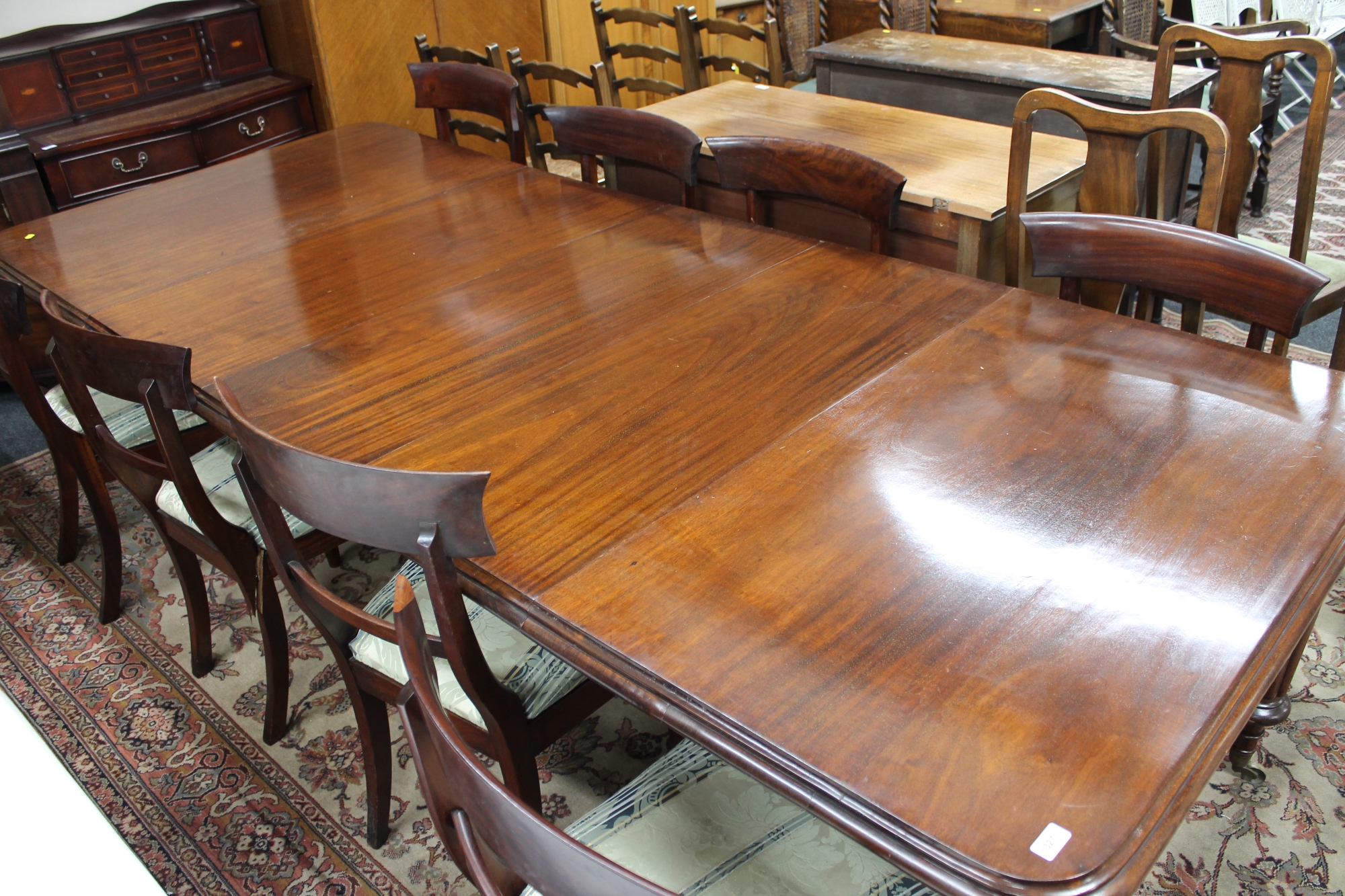 A Victorian mahogany wind-out dining table with three leaves and eight chairs CONDITION - Image 5 of 9