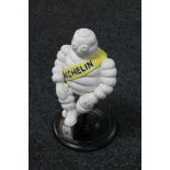 A cast iron sitting Michelin figure